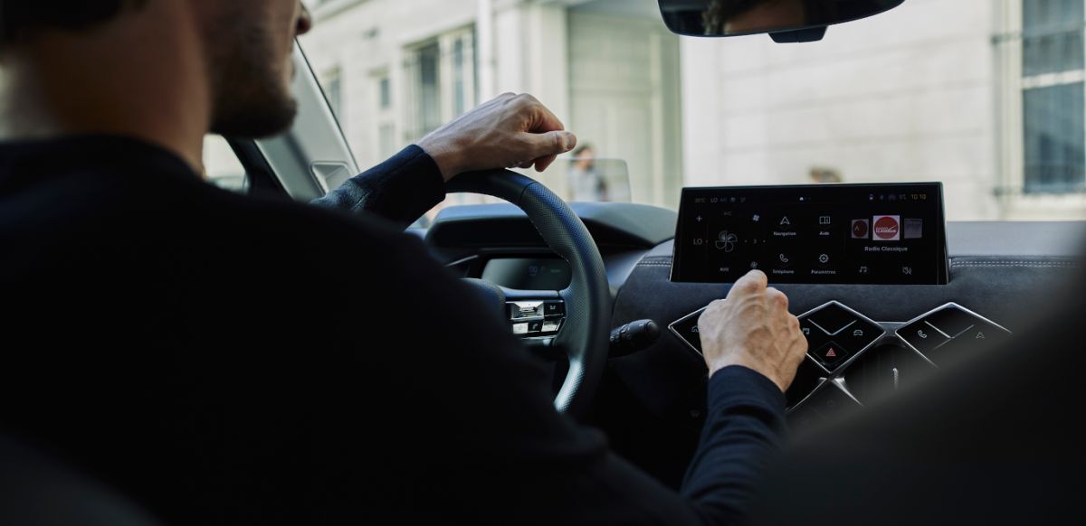 Man inside a NEW DS3 interacting with multimedia system